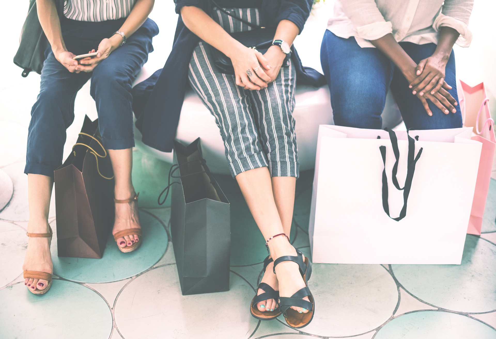 Women taking sitting taking a break while shopping